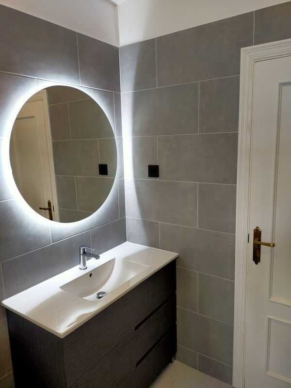 Finished grey tiled bathroom renovation in Costa del Sol